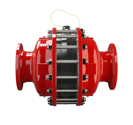 An industrial pipeline with a large bolted pressure vessel and gauges sits on a waterfront platform, with a cargo ship in the background.